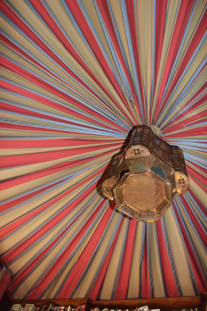 Vertical close-up of draped ceiling with lantern.